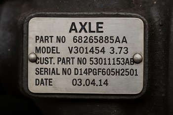 Close-up of an axle information plate on a car